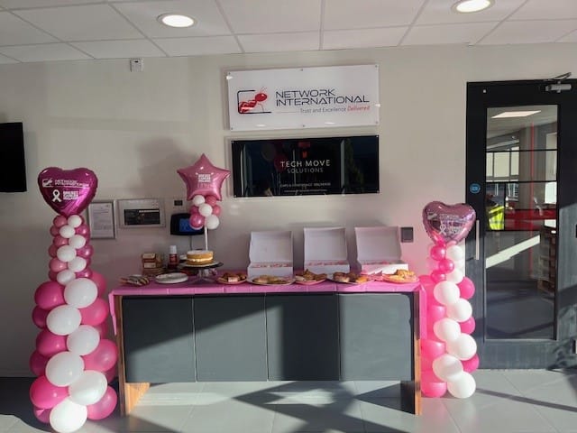 pink balloons at desk